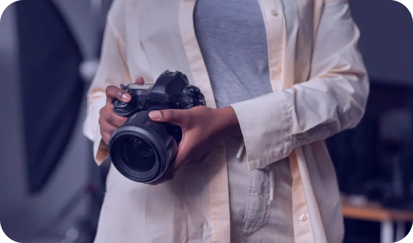 holding a camera